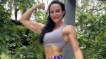 Female trainer and bodybuilder Erin Strern flexing her biceps after sharing her HIIT tips on social media